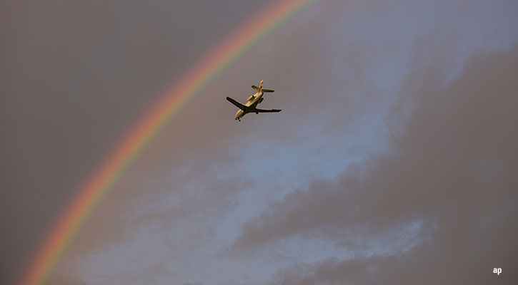 plane and rainbow